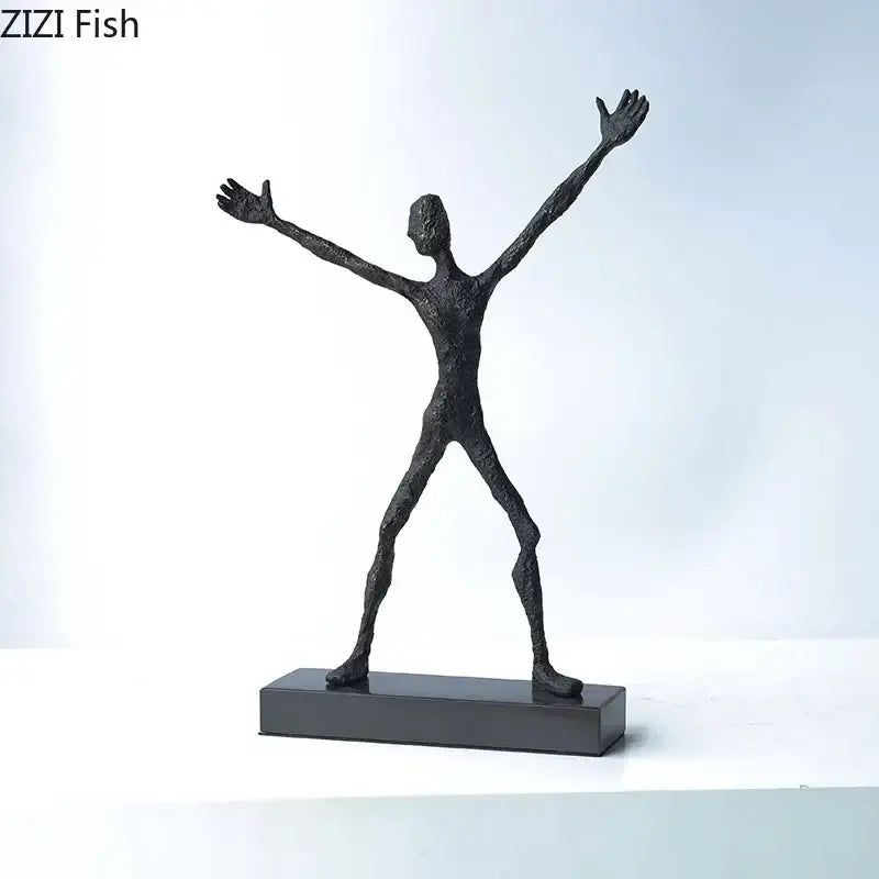 Black abstract couple statue by DecorBites featuring human figure with outstretched limbs on rectangular base for decoration
