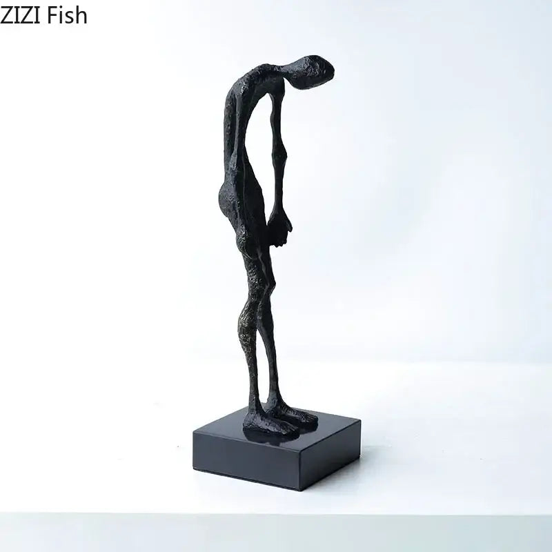 Black abstract couple statue by decorbites on matching black base for desk decoration and room aesthetics