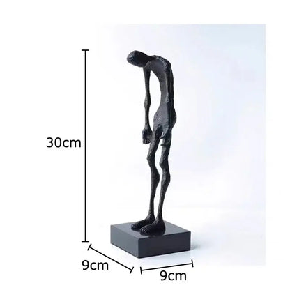 Black matte-finished abstract couple statue by decorbites on square base for desk decoration and room aesthetics