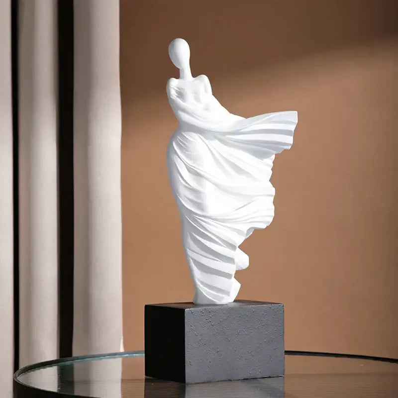 White ceramic decorbites abstract dancer figure resin sculpture of draped female on dark gray square base for modern decor