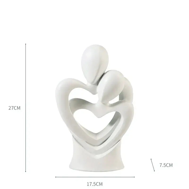 White ceramic decorbites abstract dancer resin sculpture featuring two abstract dancer figures embracing in heart frame