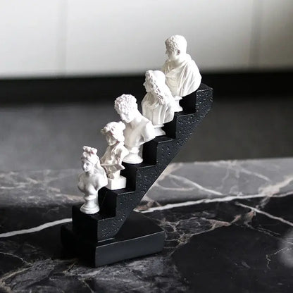 White marble busts of classical figures in a staircase design on a black base for decorbites abstract david home decor