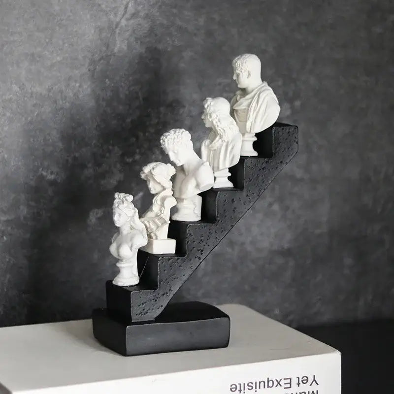 White resin busts of classical figures on a black stepped base for home decor decorbites abstract david statue