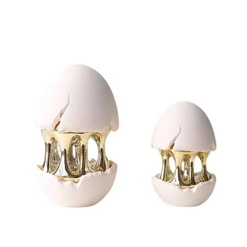 White ceramic decorative figurine with gold metallic interior and cracked shell design by DecorBites abstract eggshell hollow