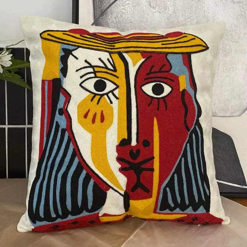 Vibrant decorbites abstract embroidery pillowcase 45x45cm with bold red yellow blue stylized abstract face design