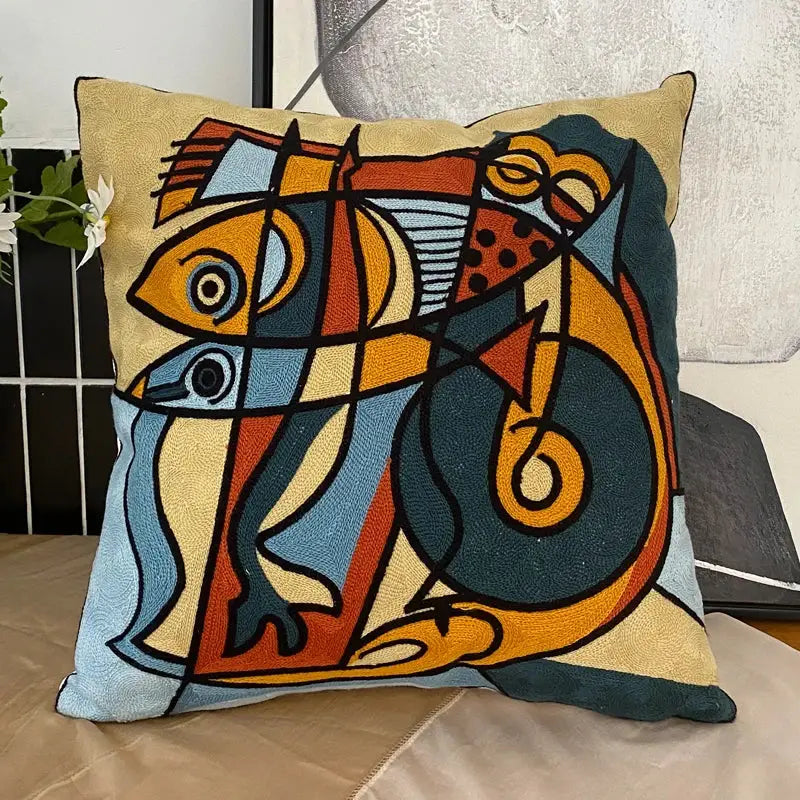 Decorbites abstract embroidery pillowcase featuring stylized fish in orange blue and teal on beige textured fabric
