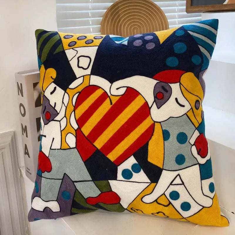 Vibrant decorbites abstract embroidery pillowcase 45x45cm with stylized figures and central striped heart in bold colors