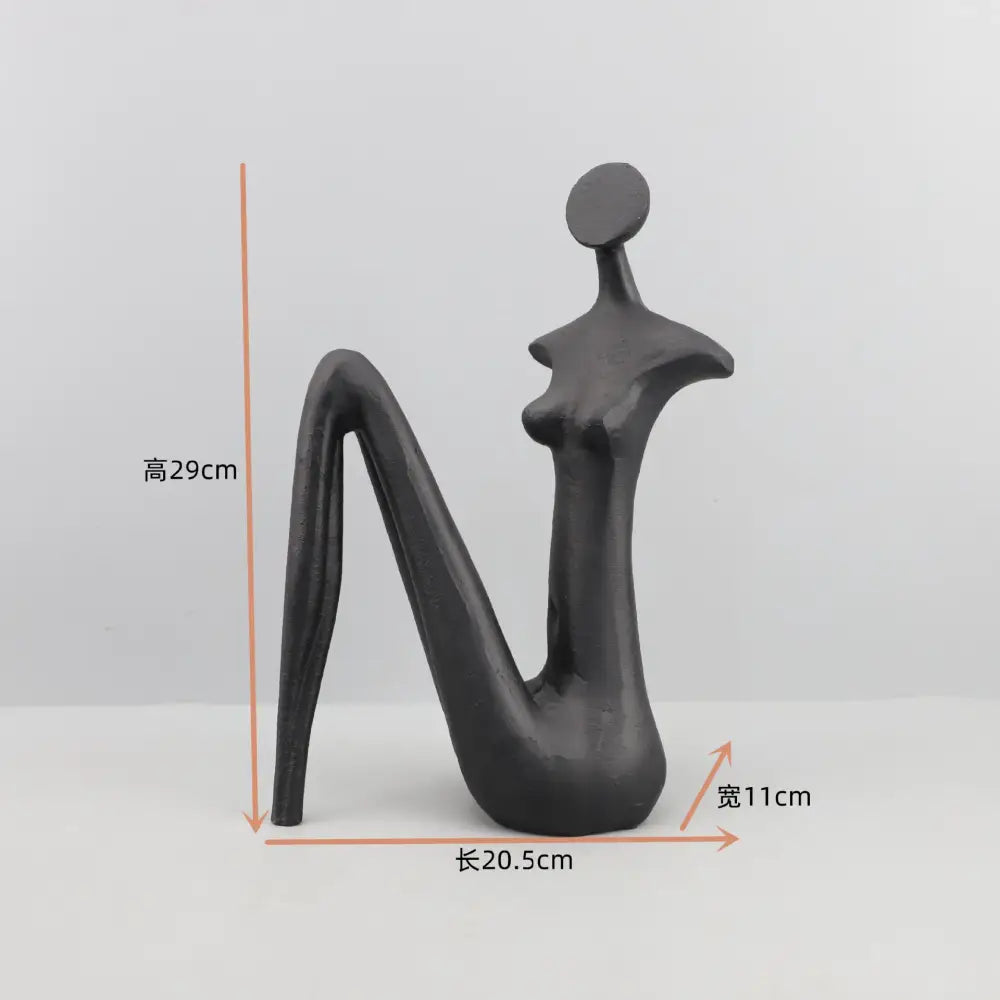 Black abstract face ceramic figurine sculpture with smooth glossy finish by decorbites for home decor accessories