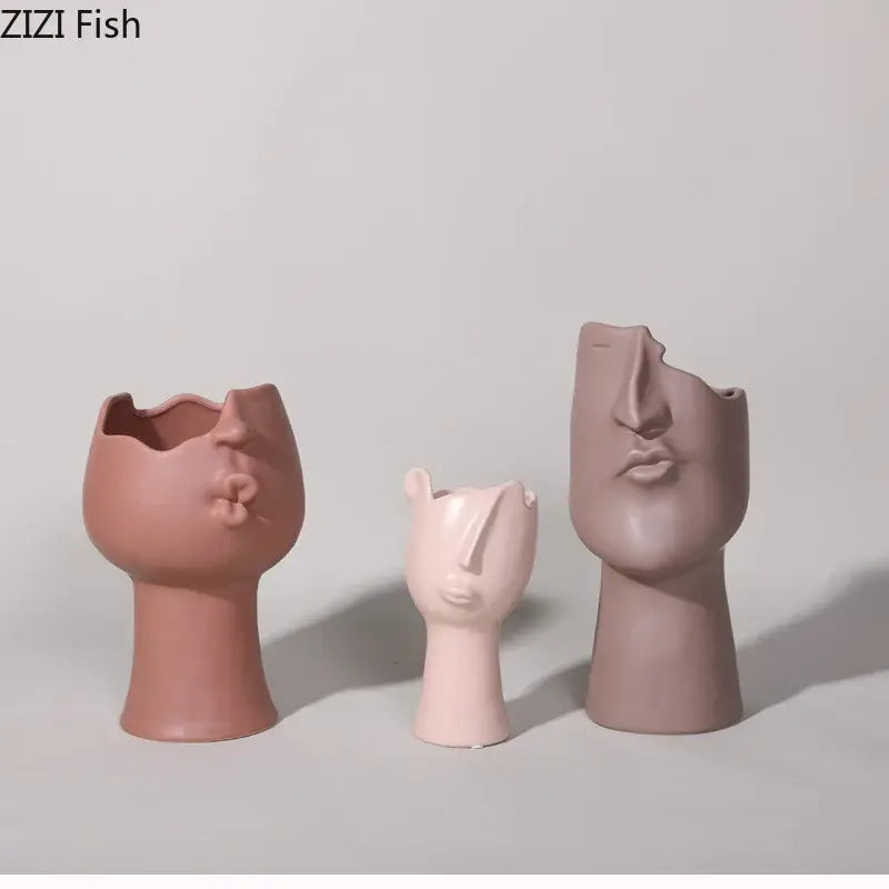 DecorBites™ abstract face ceramic vases in muted pink and mauve with unique stylized facial expressions for decor