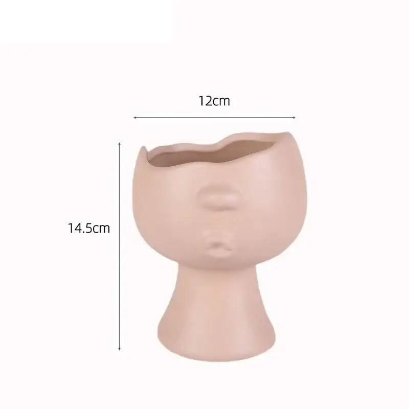 Beige decorbites abstract face ceramic vase shaped like stylized human face for table flowers decoration