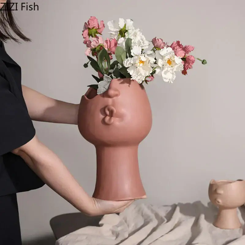 Terracotta decorbites abstract face ceramic vase shaped like a stylized human head for table flowers decoration