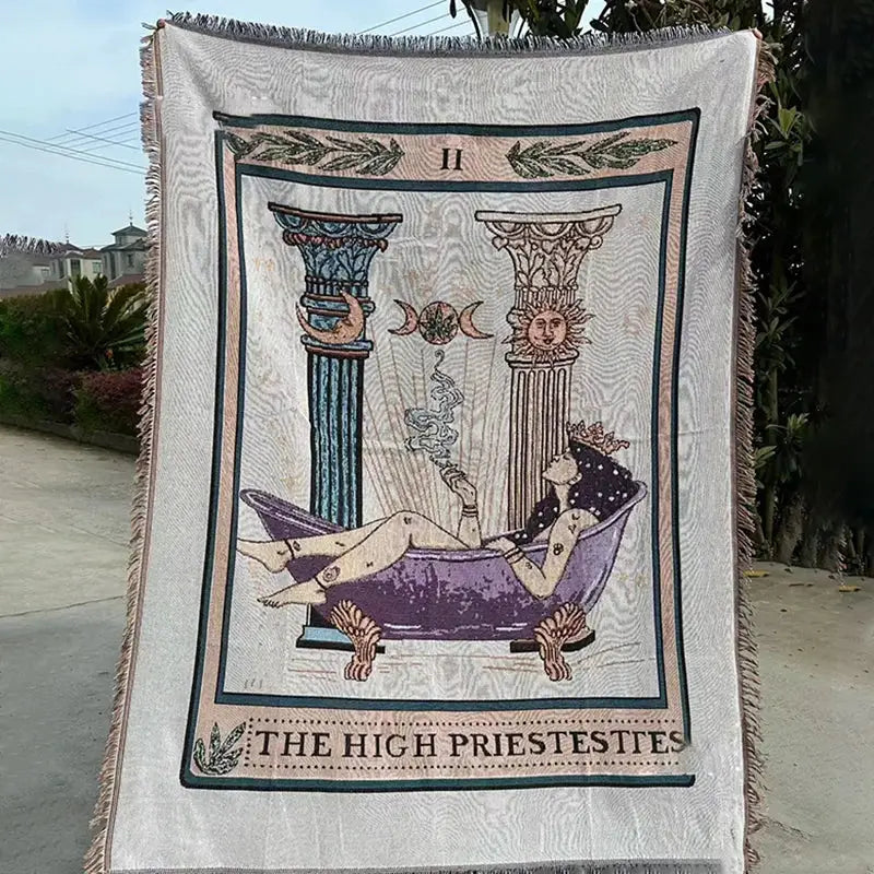 Cream-colored woven decorbites abstract face pattern face pattern throw blanket featuring the high priestess tarot card design