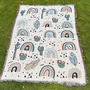 Decorbites abstract face pattern throw blanket in off-white woven fabric with colorful rainbows cacti and crystals