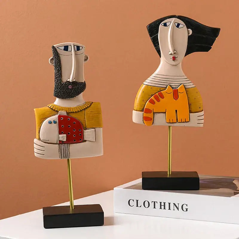 Stylized decorbites abstract face resin art figurines in bold yellow black white red and orange for home and office decor