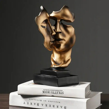 Bronze-colored DecorBites™ abstract face sculpture ornament with split design on black base for home decor and wedding gift