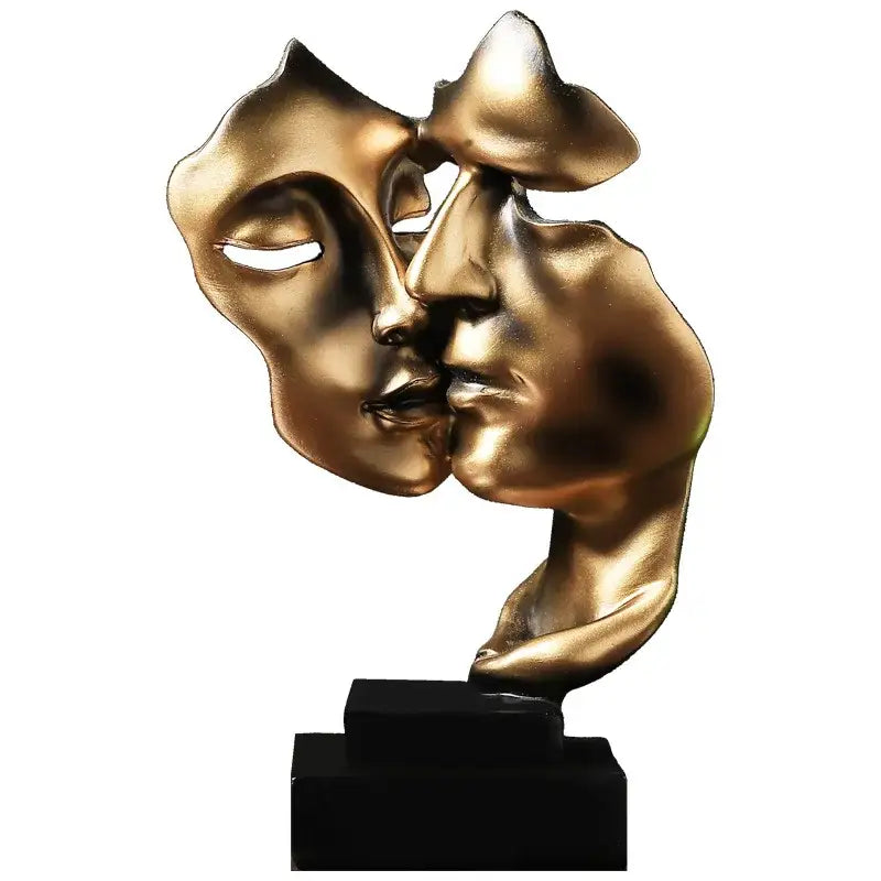 Golden metallic abstract face sculpture ornament of two faces kissing on black base for home decor and wedding gift