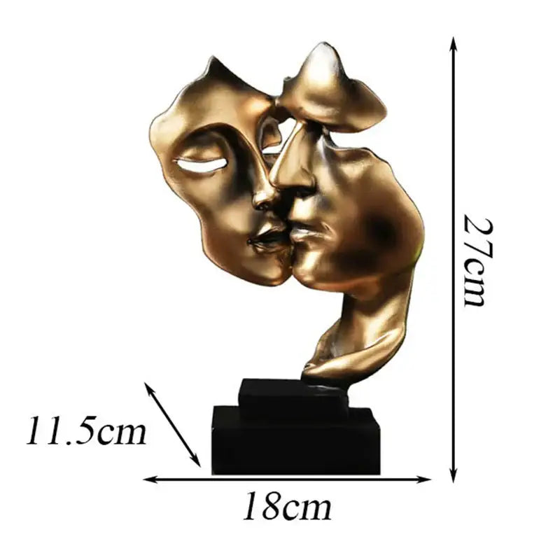 Golden metallic abstract face sculpture ornament of two faces kissing on a black base for home decor and wedding gift