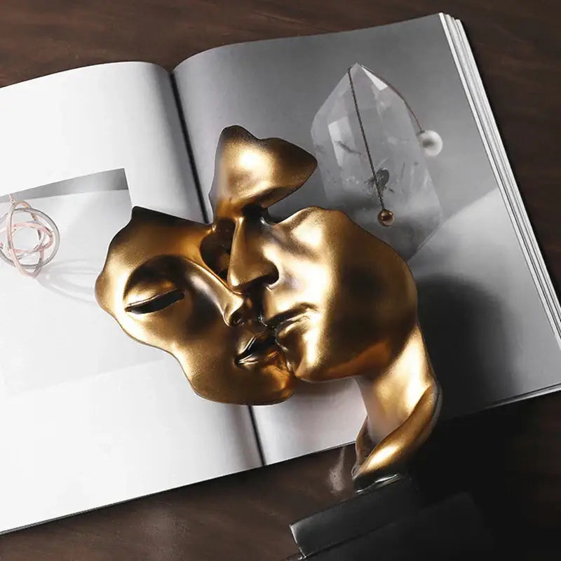 DecorBites™ abstract face sculpture ornament in golden metallic with smooth reflective surfaces for home decor and gifts
