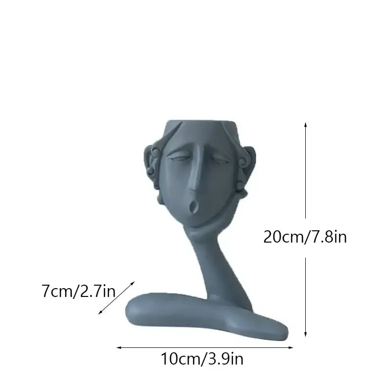 Gray ceramic decorbites abstract family flowerpot ornament with stylized human face and serene expression for home decor