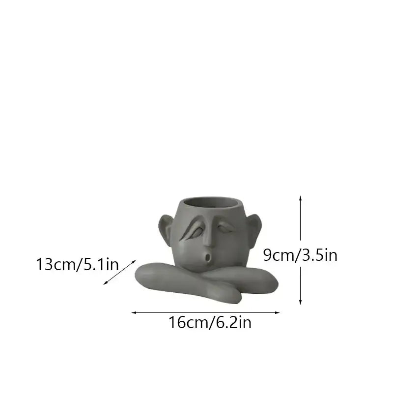 Gray ceramic flowerpot ornament shaped like a sleeping face with crossed arms decorbites abstract family flowerpot for home decor