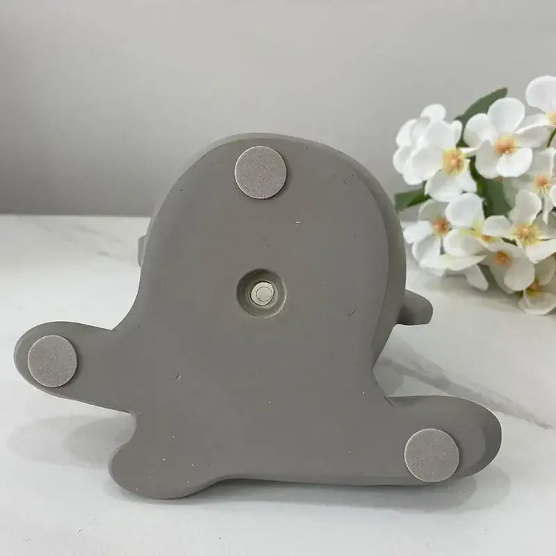 Gray ceramic octopus-shaped decorbites abstract family flowerpot ornament with three metallic feet and central hole for decoration