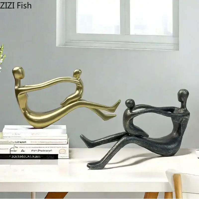 Decorbites abstract family resin sculpture featuring polished gold and matte black stylized human figurines for decor