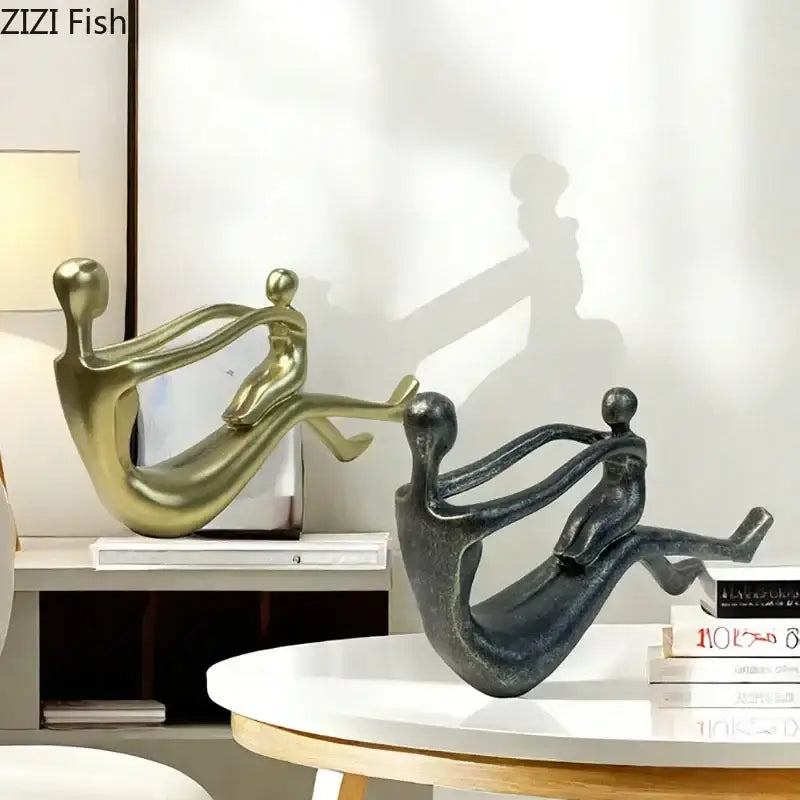 Decorbites abstract family resin sculpture features gold and black stylized human forms for desk decor and room aesthetic