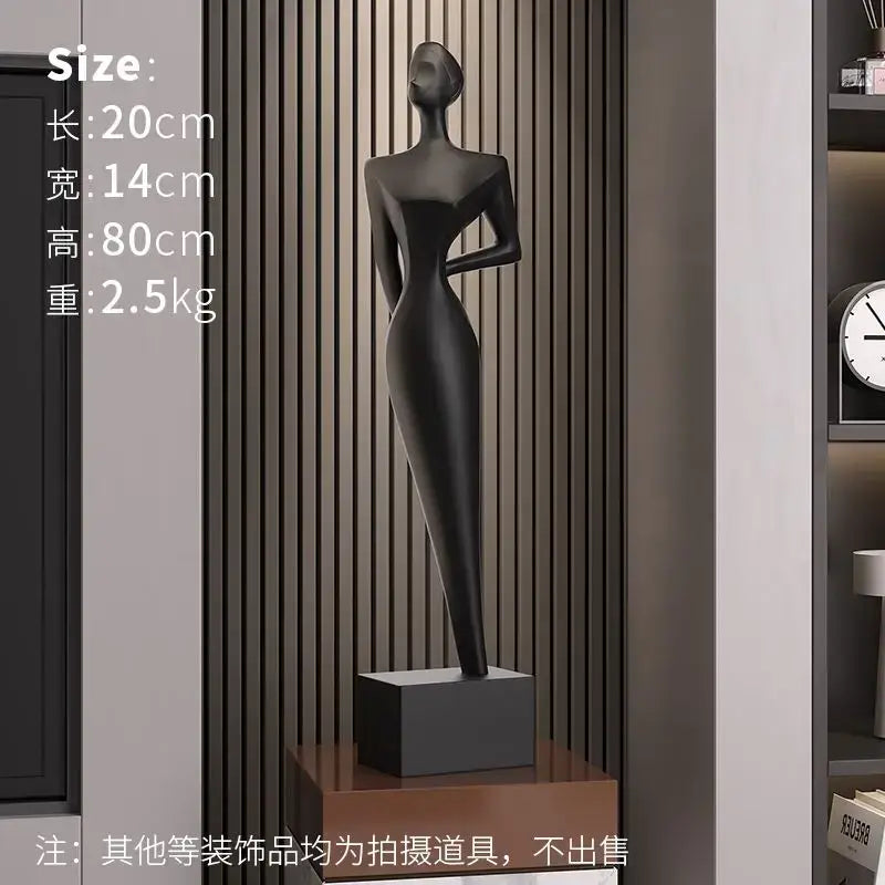Black matte-finished decorbites abstract figure art sculpture of a female form on square base for luxury living decor