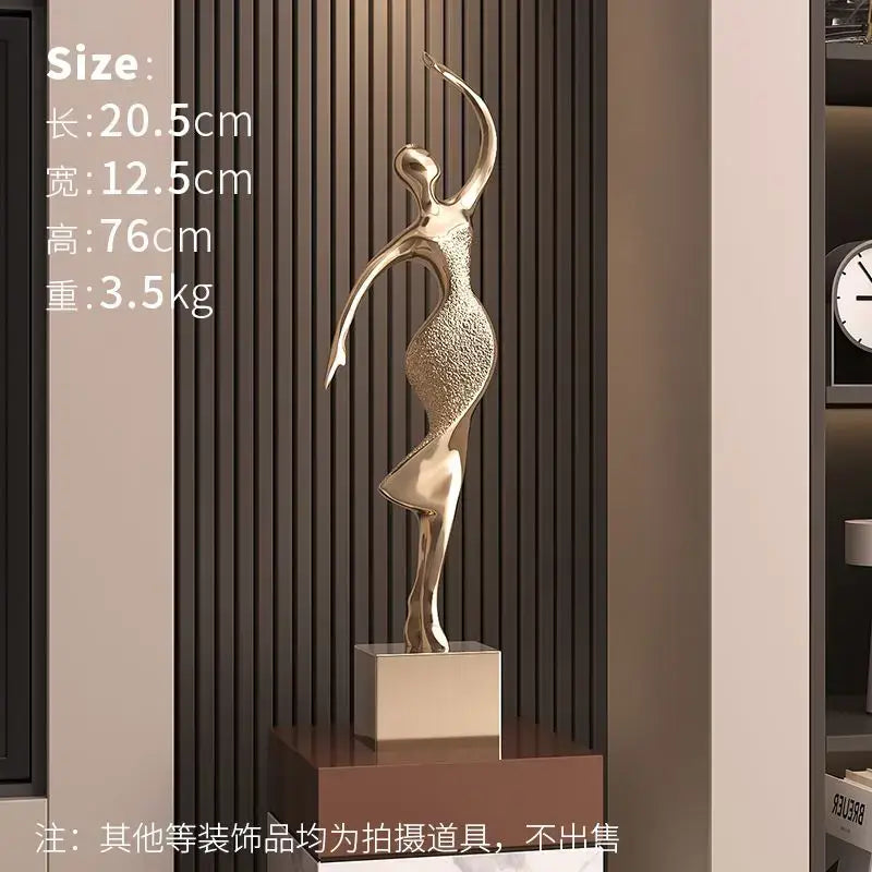 Golden metallic decorbites abstract figure art sculpture with textured torso and smooth limbs for luxury living room decor