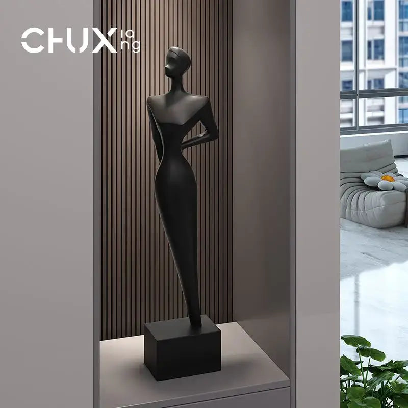 Black matte-finished decorbites abstract figure art sculpture on a matching square base for luxury living room decor