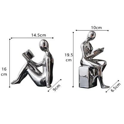 Shiny silver metallic decorbites abstract figure bookend set featuring seated human figures reading books for home decor