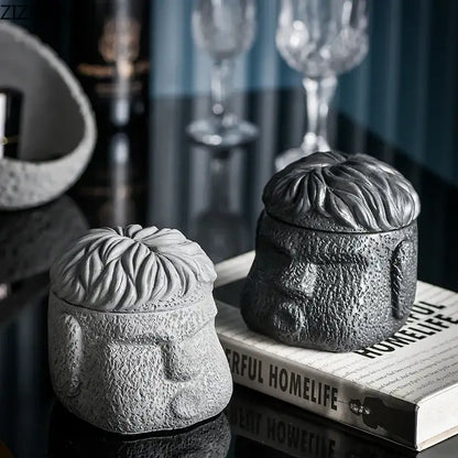 Gray concrete sculpture of a man’s head in lighter and darker tones for decorbites™ abstract figure portraits cement ashtray