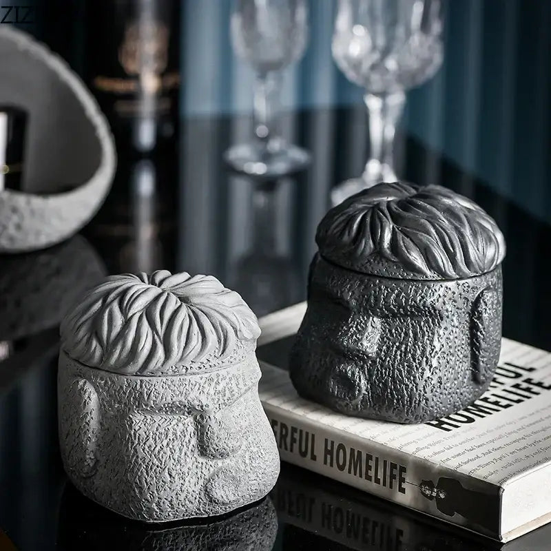 Gray concrete sculpture of a man’s head in lighter and darker tones for decorbites™ abstract figure portraits cement ashtray