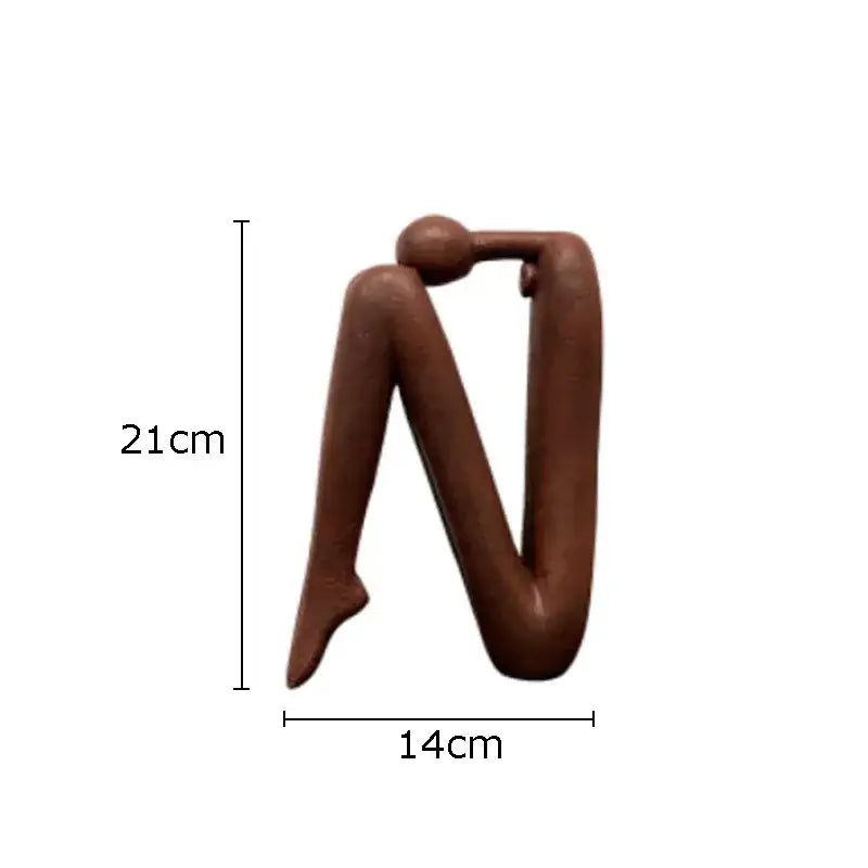 Brown decorbites abstract figure resin sculpture with smooth glossy finish and minimalist human form for desk decor