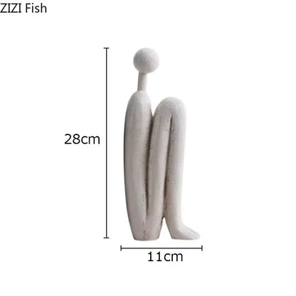 Minimalist white ceramic resin sculpture decorbites abstract figure depicting a smooth seated abstract figure for desk decor