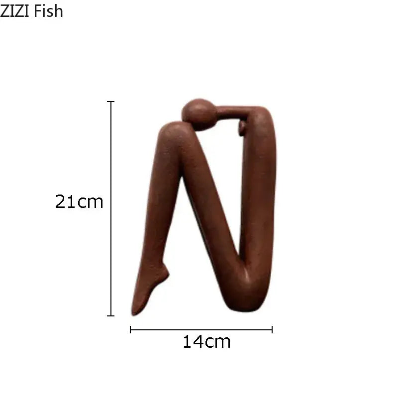 Brown decorbites abstract figure resin sculpture with stylized human form and smooth matte finish for modern decor