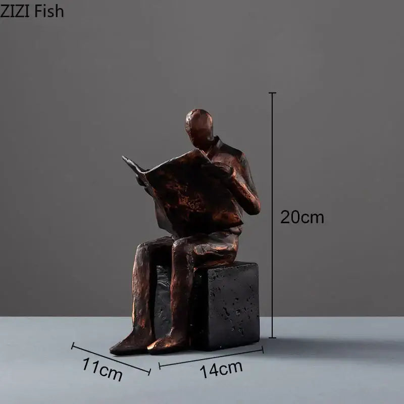 Bronze decorbites abstract figure sculpture bookend of a seated man reading newspaper on dark textured resin base