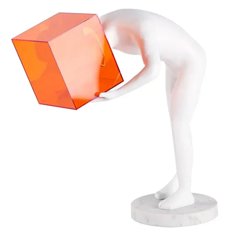 Decorbites™ abstract white sculpted figure holding an orange translucent cube cage human body mind figurine
