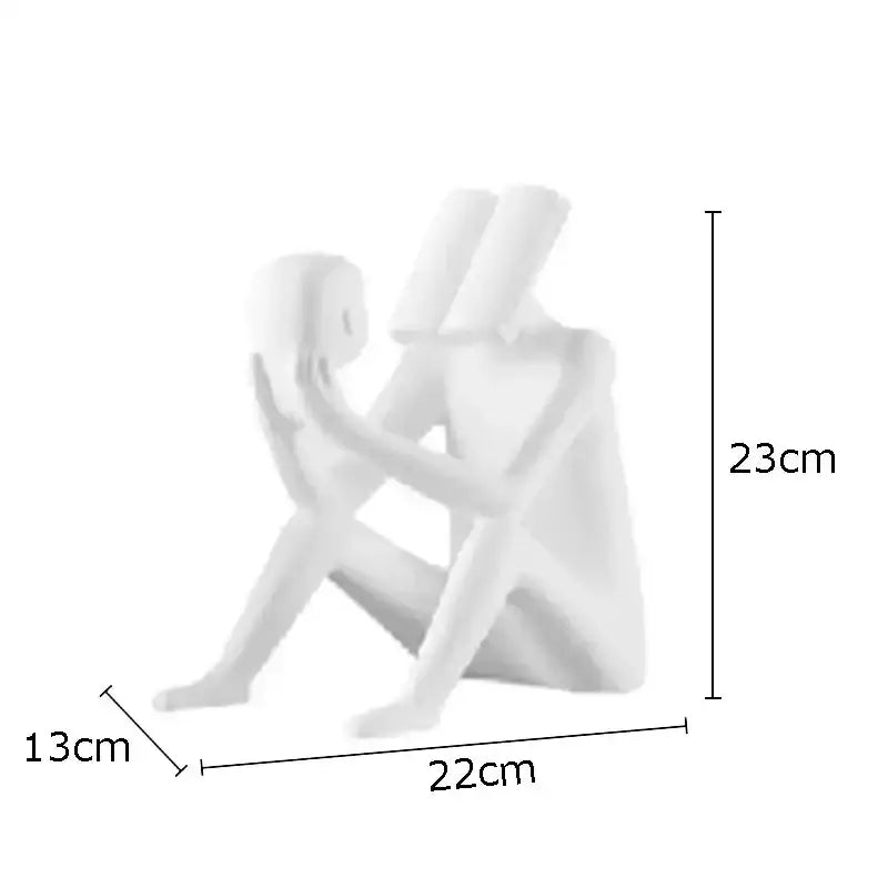 White decorbites abstract figure sculpture featuring two stylized human figures in an intimate seated pose for decor