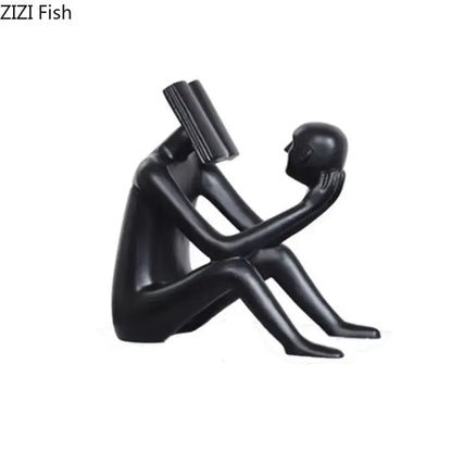Black glossy resin decorbites abstract figure sculpture of two intimate human forms with book-like object for room decor