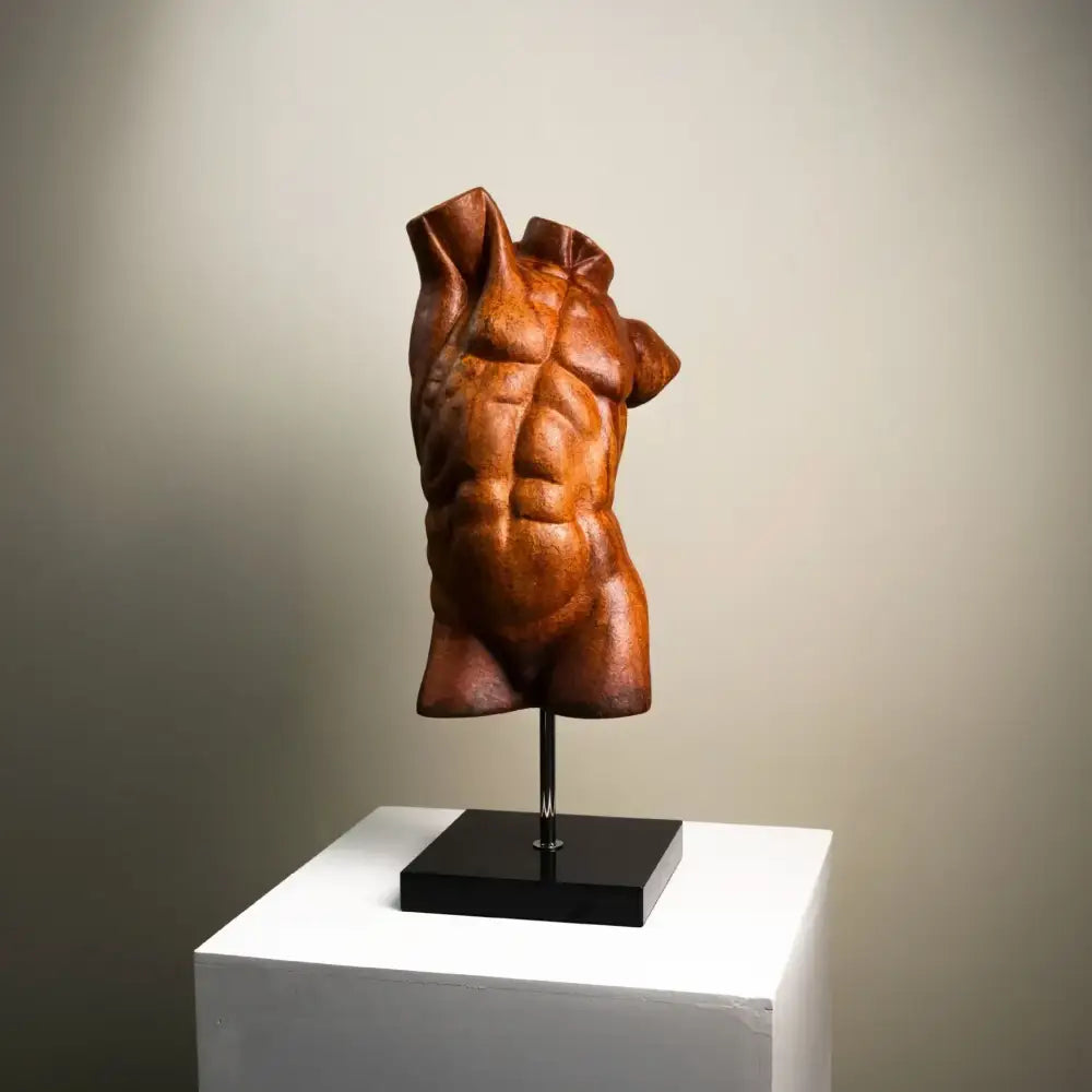 Bronze-colored muscular torso decorative figurine with detailed abs and draped fabric folds by decorbites abstract figure sculpture