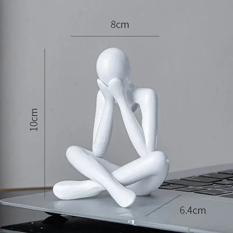White glossy resin decorbites abstract figures ornament sculpture of a seated contemplative figure for home office decor
