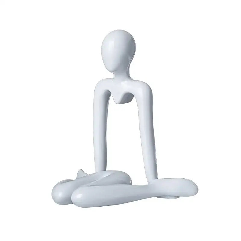 White glossy resin decorbites abstract figures ornament sculpture of a minimalist seated human form for home decor