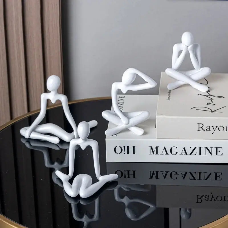 White minimalist decorbites abstract figures ornament sculpture with smooth glossy surfaces in various seated poses for home decor