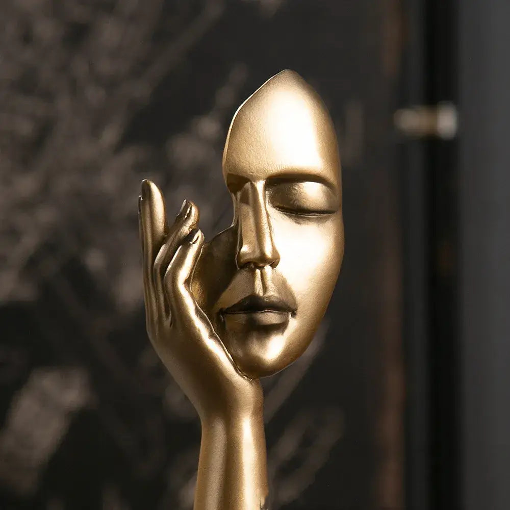 Decorbites abstract figurines golden metallic face sculpture with closed eyes cradled by hand modern art decor