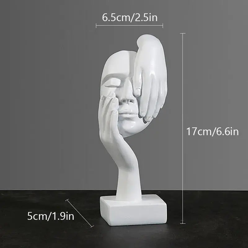 White resin decorbites abstract figurines sculpture showing a face with two hands cradling it on a square base
