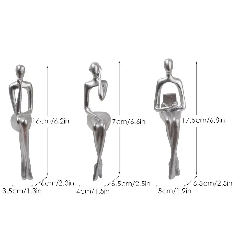 Set of three silver-toned decorbites abstract figurines with minimalist design for modern home and office decor