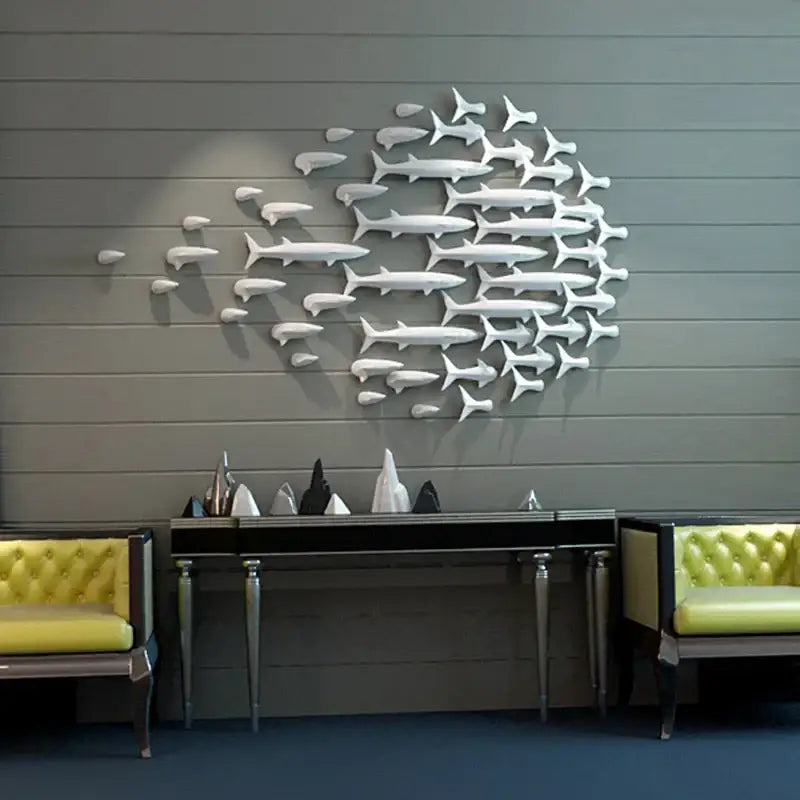 White metallic decorbites abstract fish ceramic wall sculpture arranged in swirling school pattern for children’s room