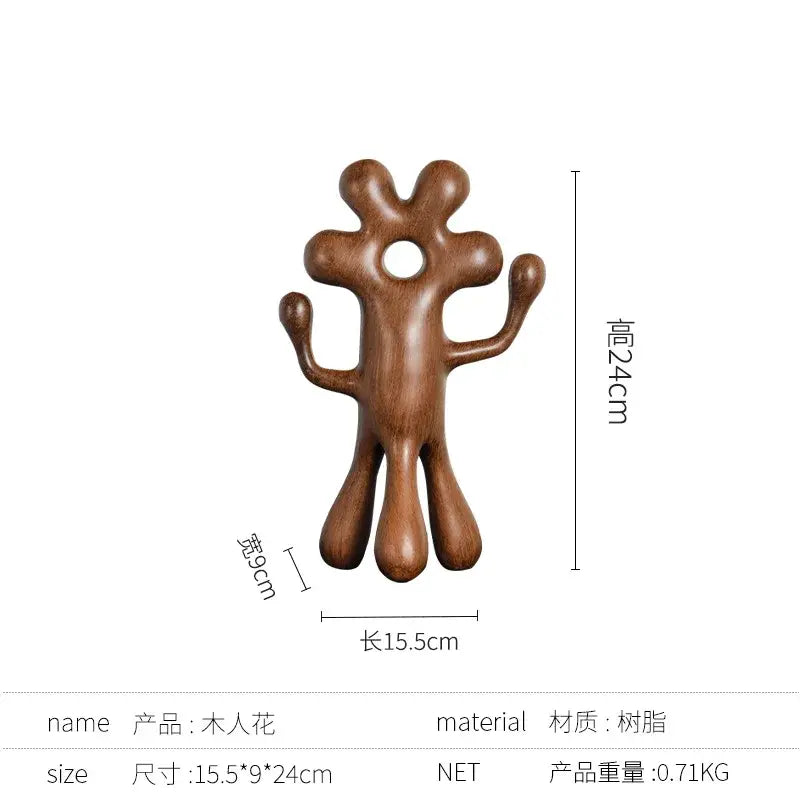 A smooth brown wooden decorbites abstract flower man sculpture with rounded limbs for home decor use