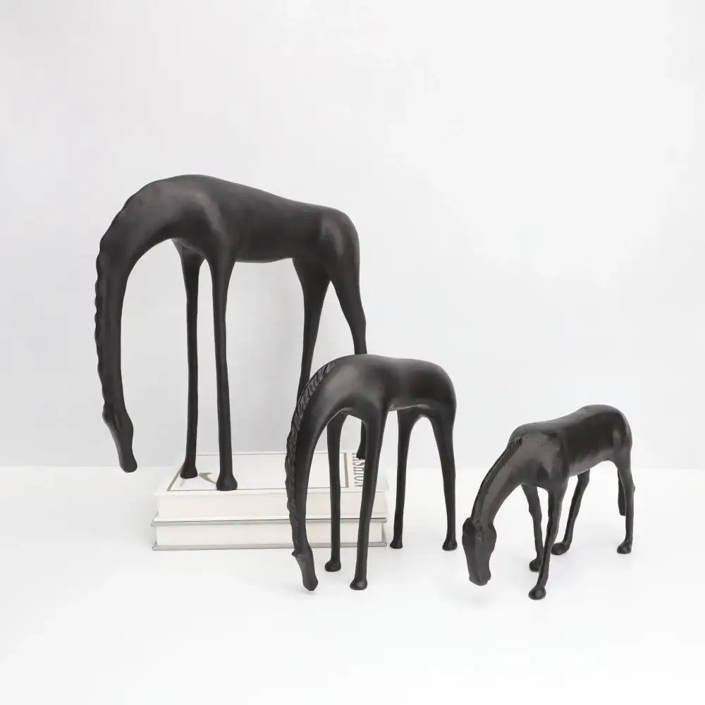 Set of three sleek black resin horse iron sculptures with elongated legs and stylized manes decorbites abstract horse decor